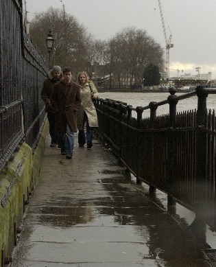 Picture of people walking along walkway today in the rain