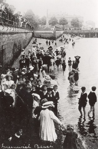 Old photograph of children enjoying Greenwich Beach below the walkway